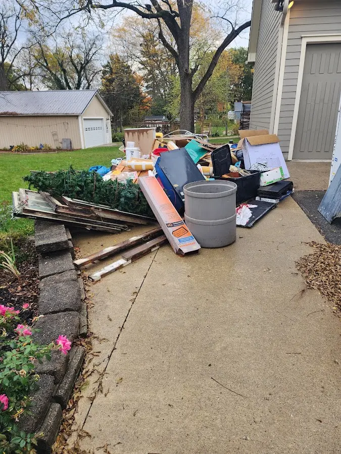 Dumpster being loaded with debris for Residential Dumpster Rental in Mendota